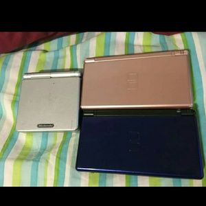 Pink Nintendo ds and grey gameboy advanced